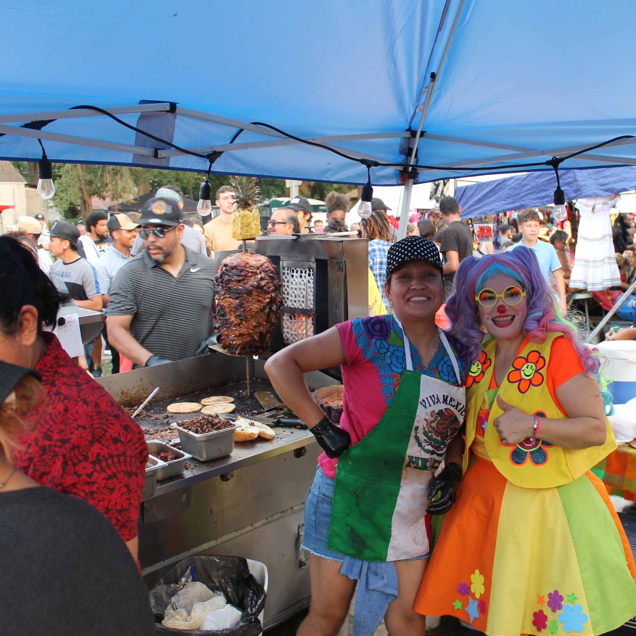 conchis posing with a clown who was special entertainment for the day