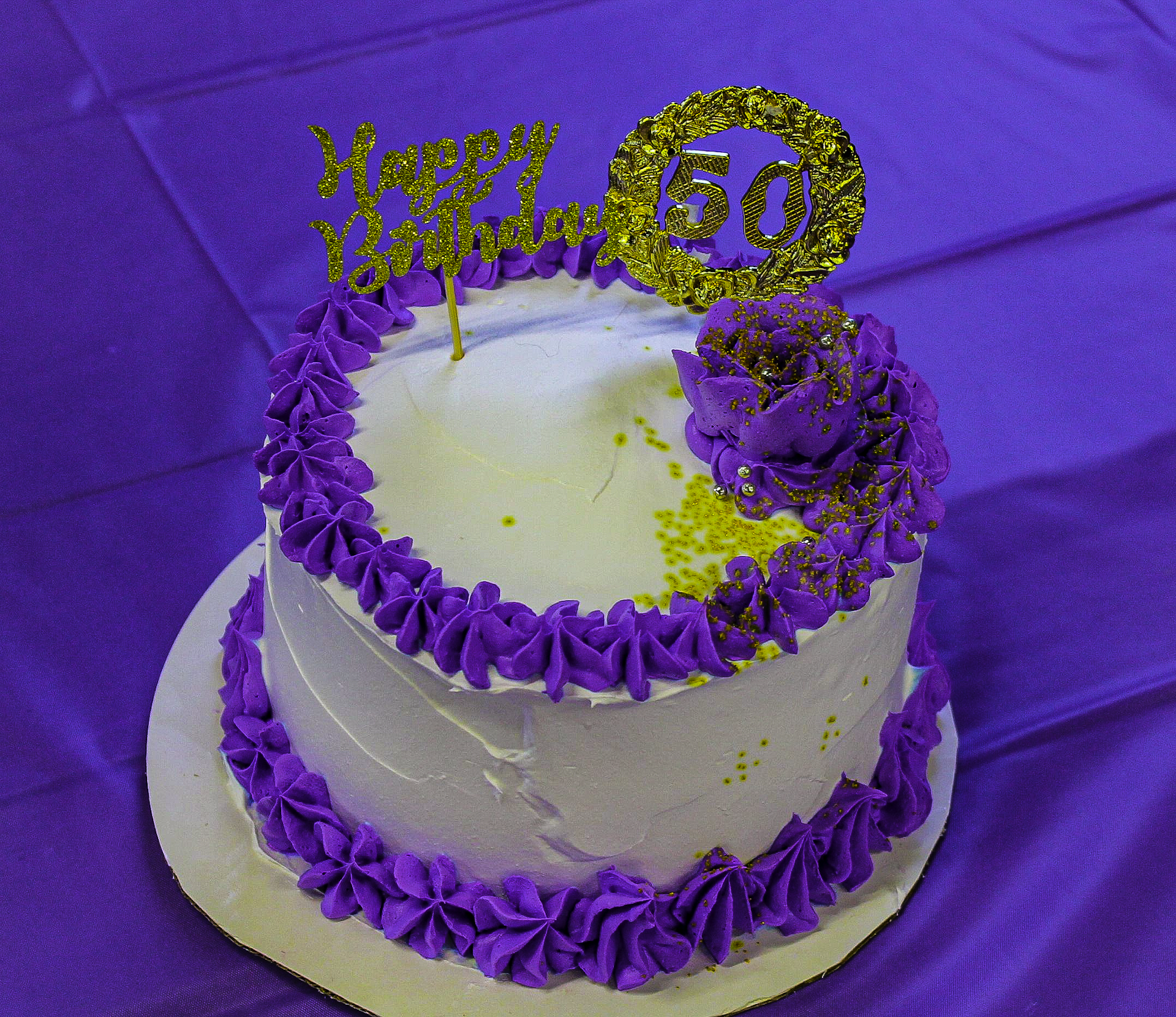 8in. cake with white and purple frosting
