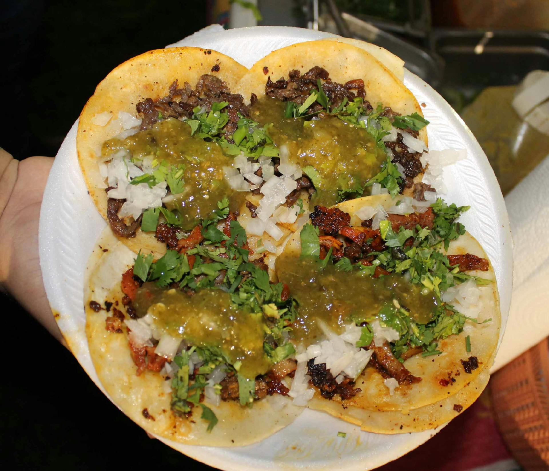 an order of four tacos by a customer made with all the toppings and delicious mild salsa