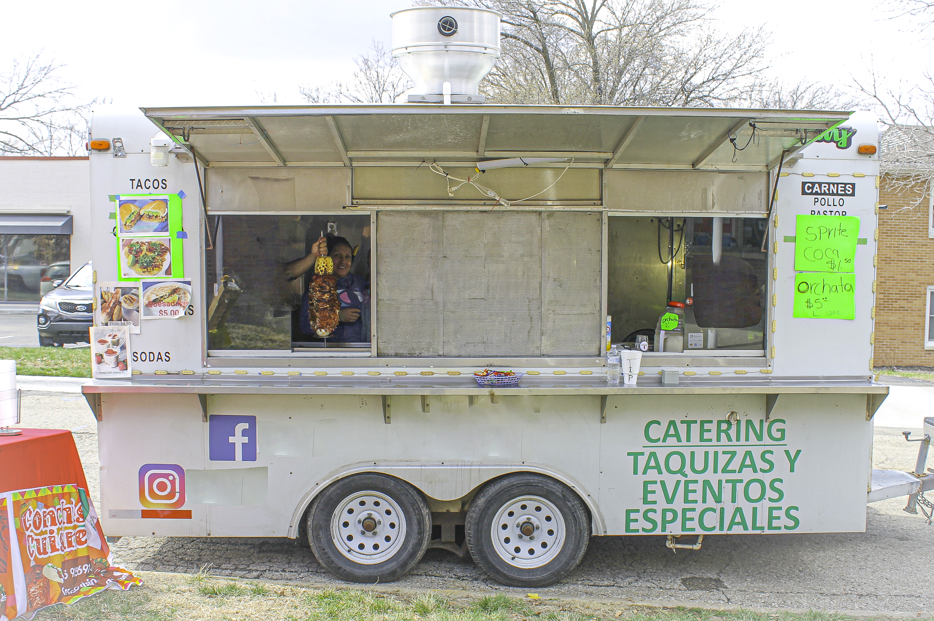 Consepcion set up in her food truck with her trompo and all of her food items